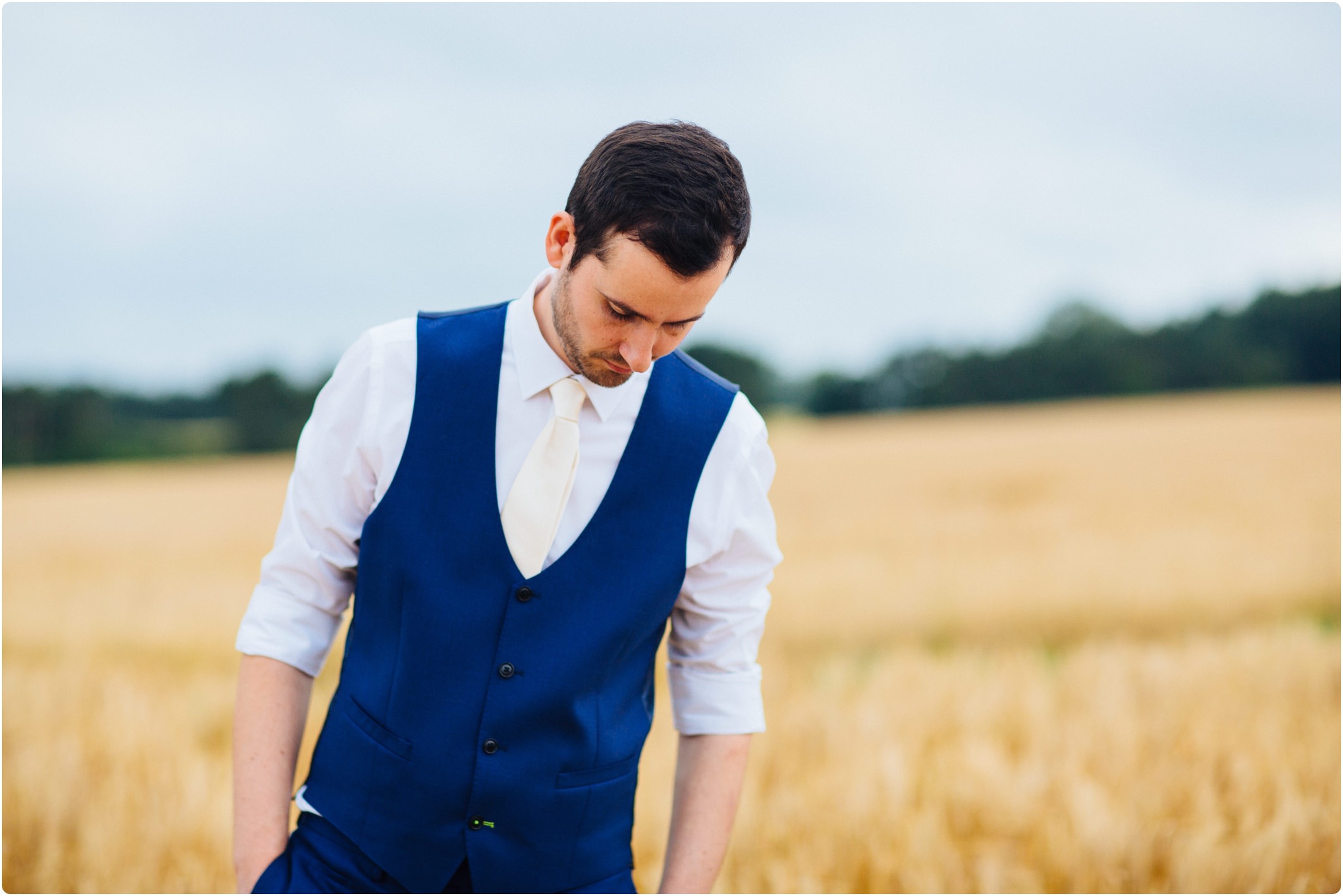 Groom with waistcoat and rolled up sleeves
