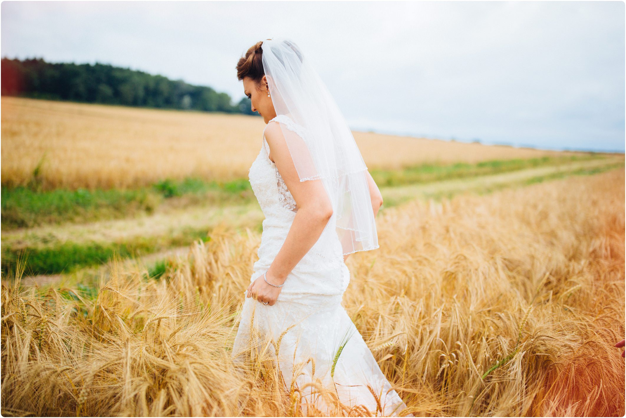 Swallows Nest Barn bride walking through field