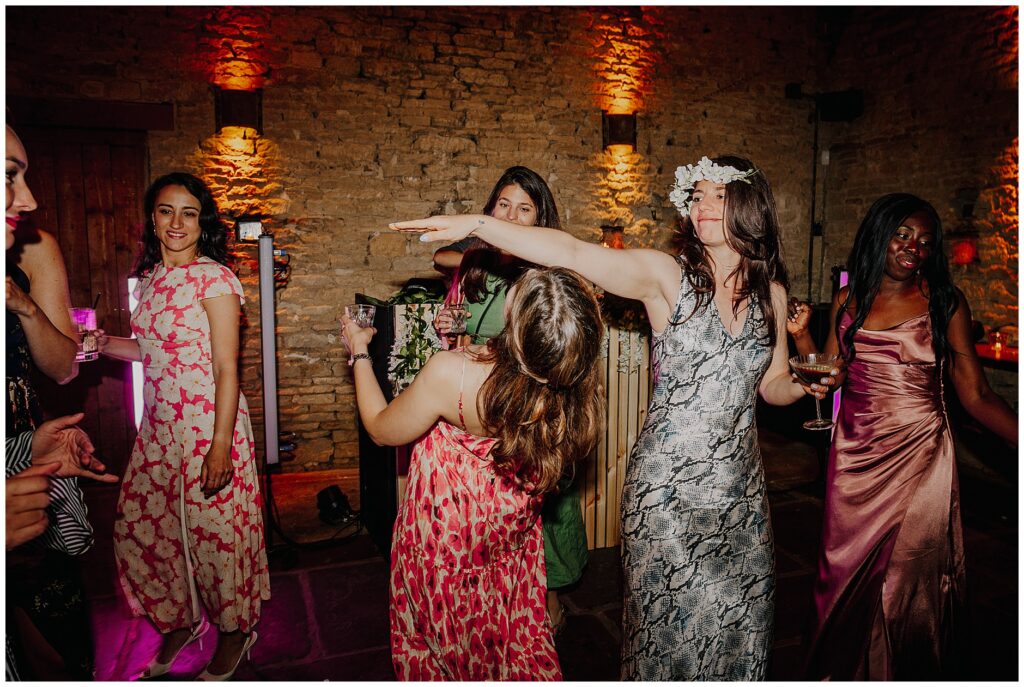 girls dancing at Cripps Barn wedding