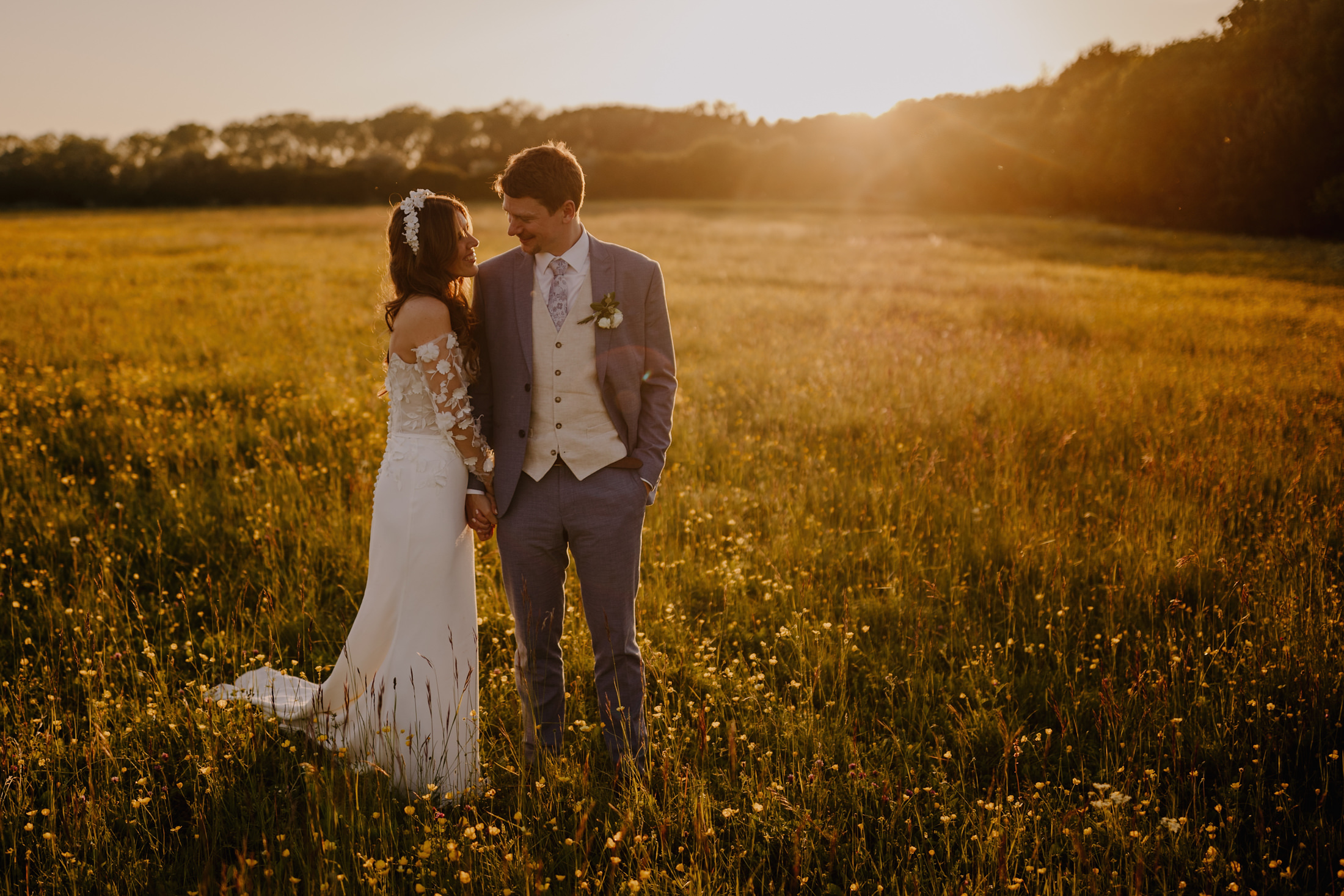 golden hour shot in the field at Cripps Barn with a bride and groom