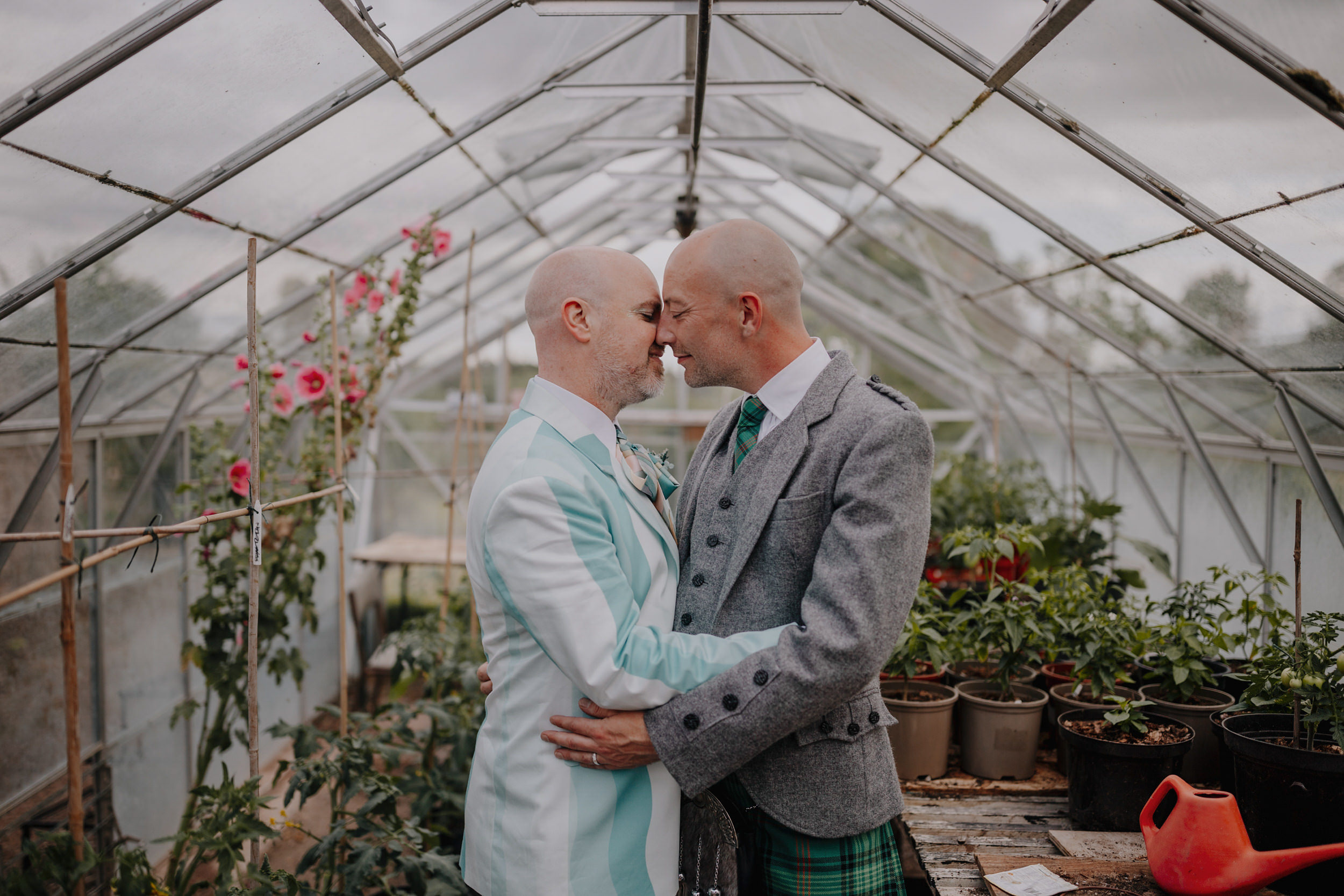 gay couple relaxed portraits at broad field court greenhouse