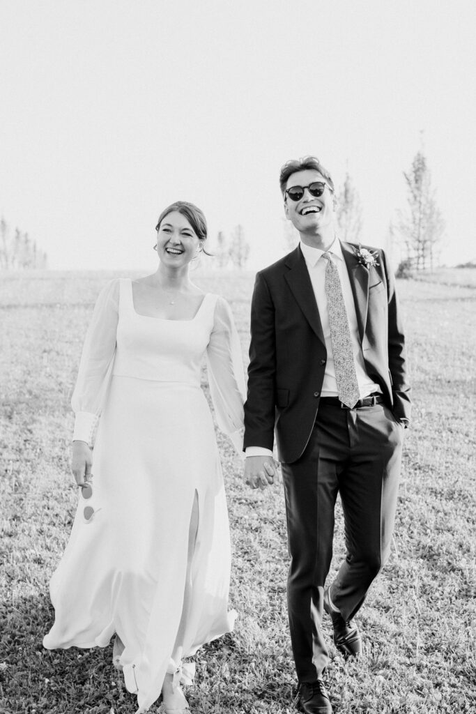 relaxed wedding couple portrait of couple walking at Cripps Barn in the cotswolds
