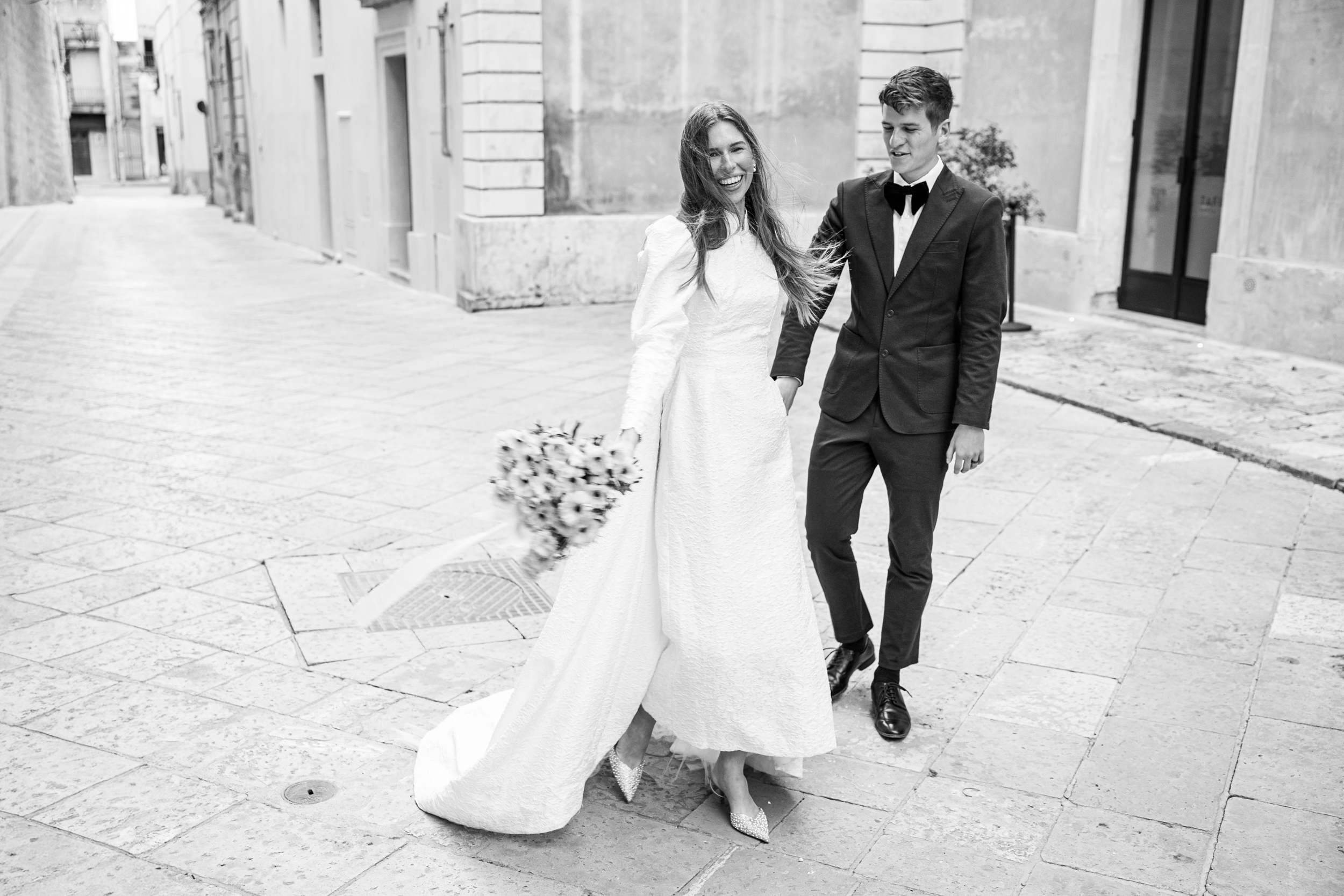 wedding couple in streets of Nardo in Puglia having relaxed wedding photos